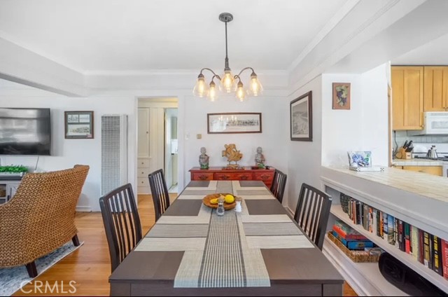404 9th Street Huntington Beach, CA 92648 - Photo 6 of 19 a view of a dining room with furniture window and wooden floor