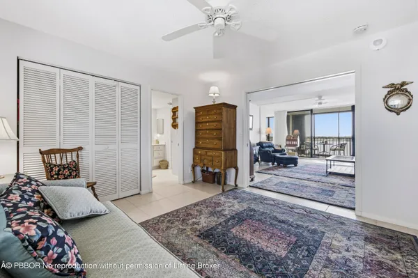 a bedroom with furniture and a rug
