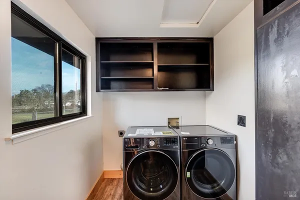 a view of room with washer and dryer