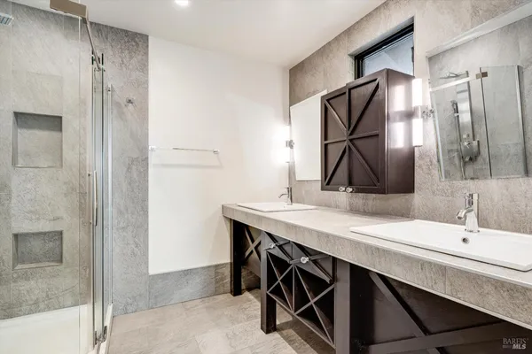 a bathroom with a sink and a mirror