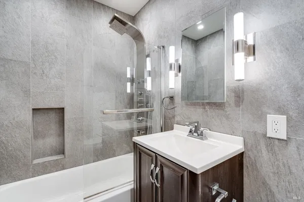 a bathroom with a sink and a mirror