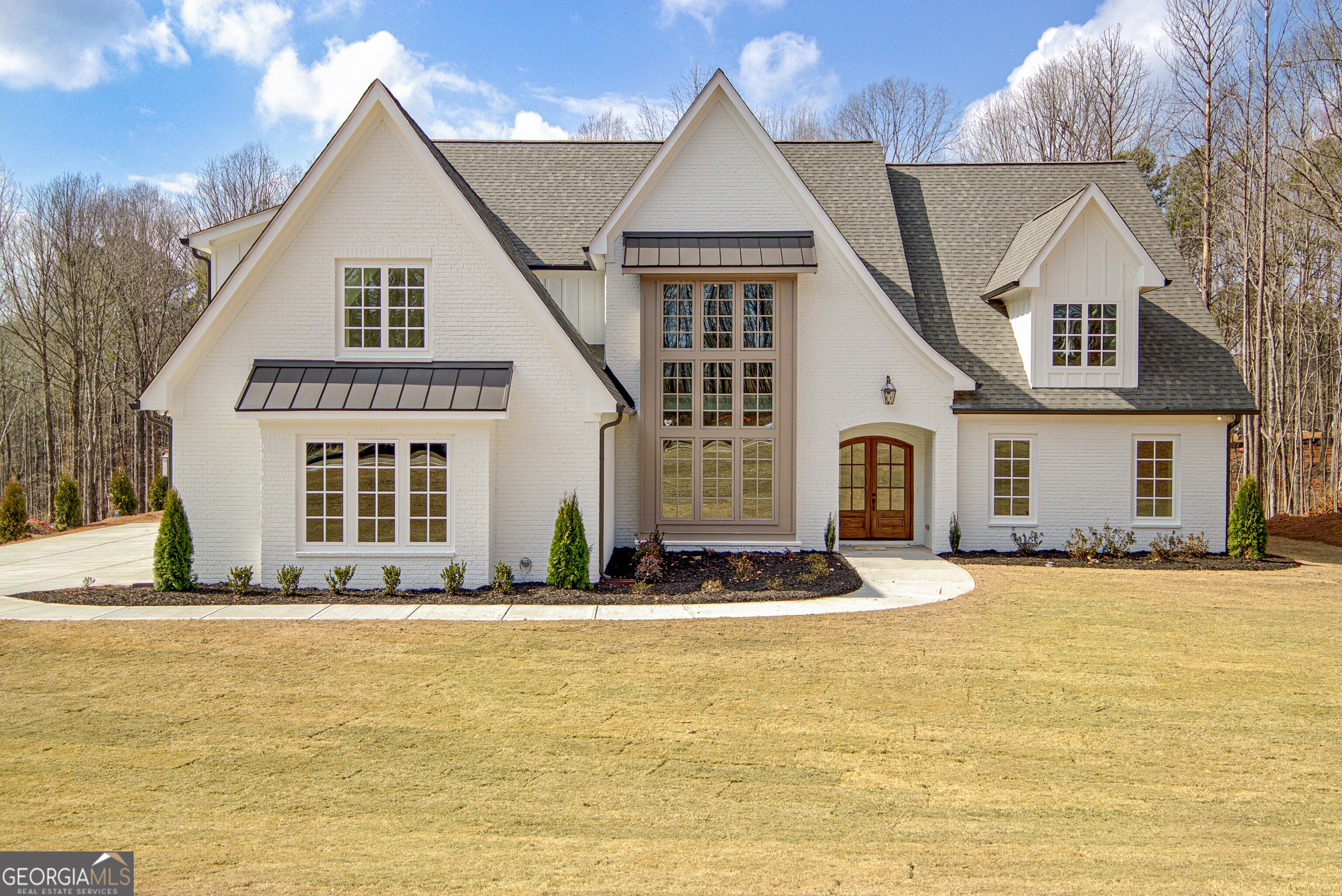 a front view of a house with a yard