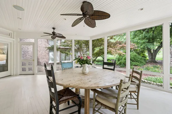 a backyard with a table and chairs