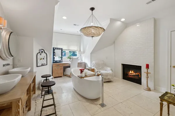 a bedroom with furniture and a chandelier