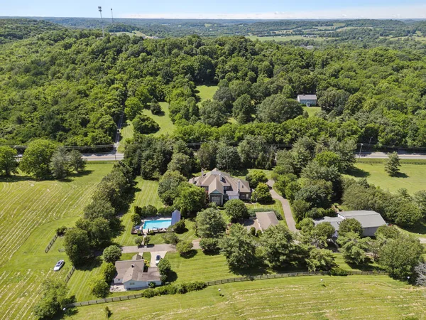 an aerial view of a houses with a lake view