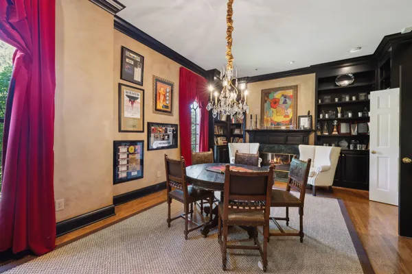 a bedroom with furniture and a large window