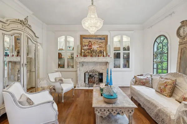 a view of a a dining room with furniture window and wooden floor