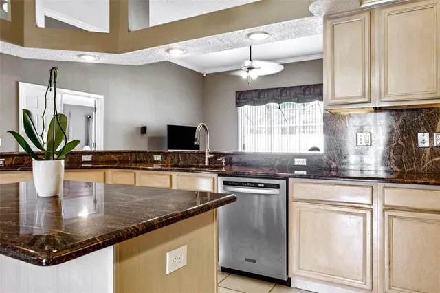 a stove top oven sitting inside of a kitchen