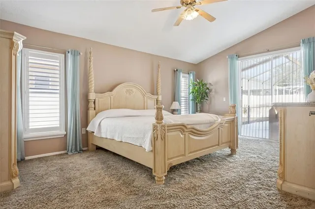 a spacious bathroom with a tub shower and window