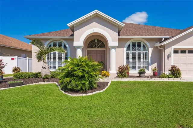 a front view of a house with garden