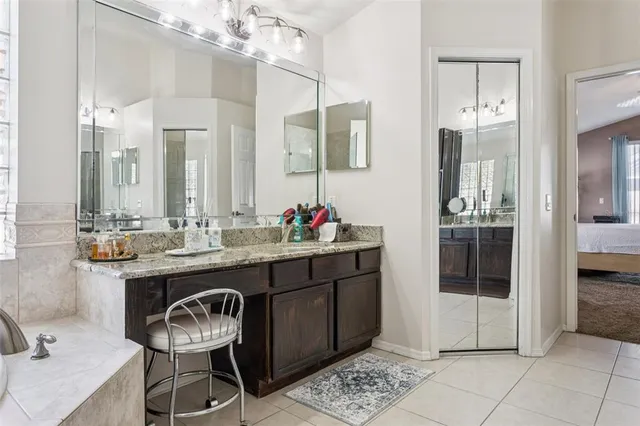 a view of a dining room with a table and chairs