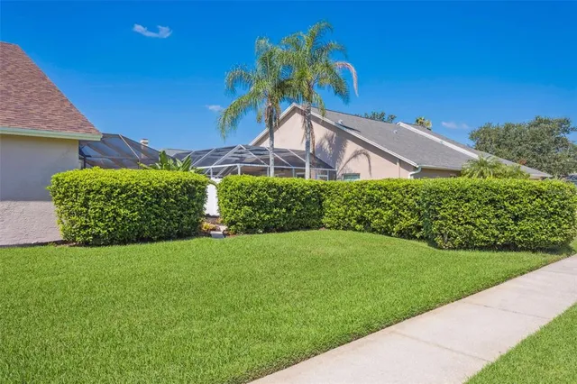 an aerial view of a residential houses with outdoor space and street view