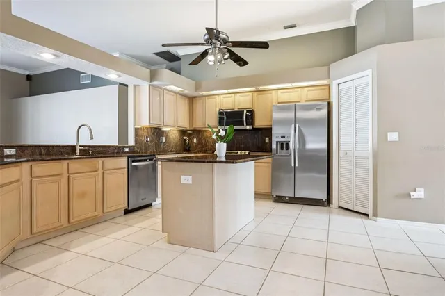 a kitchen with a refrigerator and a microwave