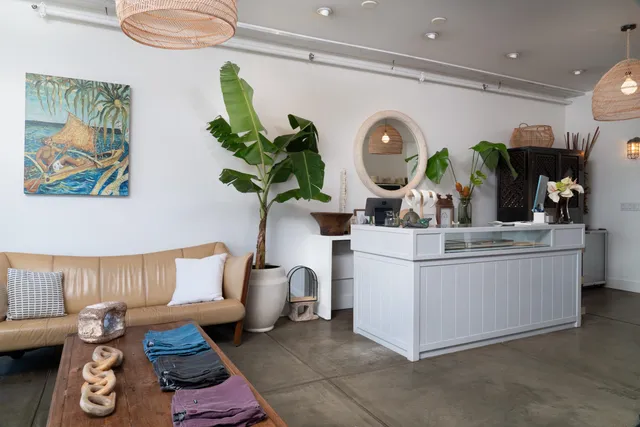 a view of a workspace with furniture and window