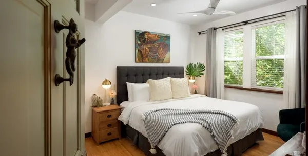 a bedroom with a bed and window