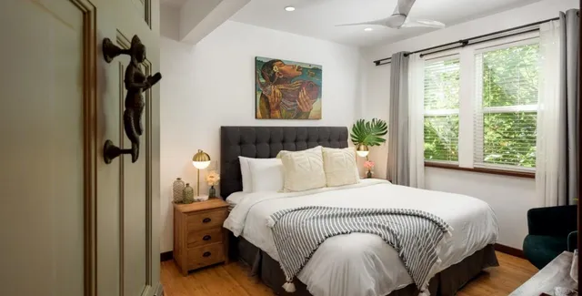 a bedroom with a bed and window