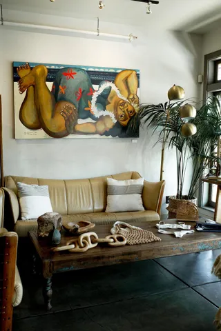 a bedroom with a bed and a chair