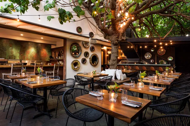 a view of a chairs and tables in a patio
