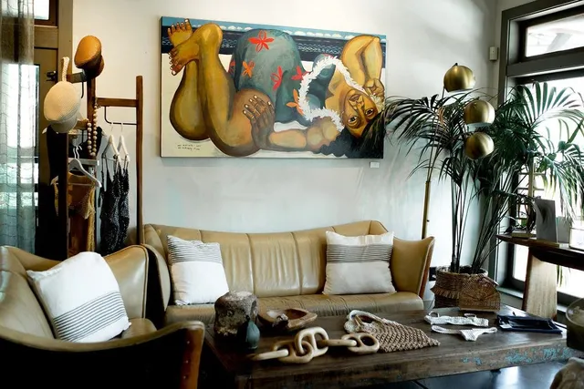 a living room with furniture and a mirror