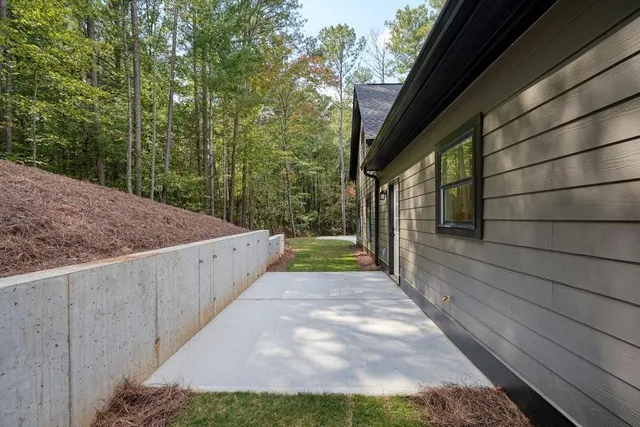 a house view with swimming pool and wooden bench