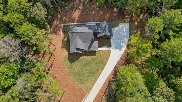 an aerial view of residential house and green space