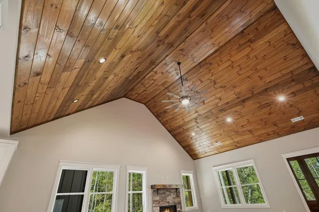 a kitchen with a refrigerator a sink and cabinets