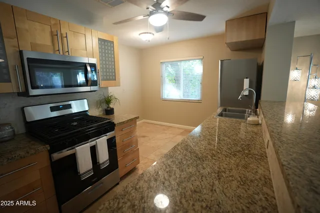 a kitchen with a stove and a microwave