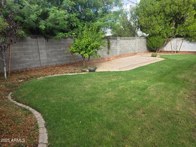 a view of a backyard with a garden