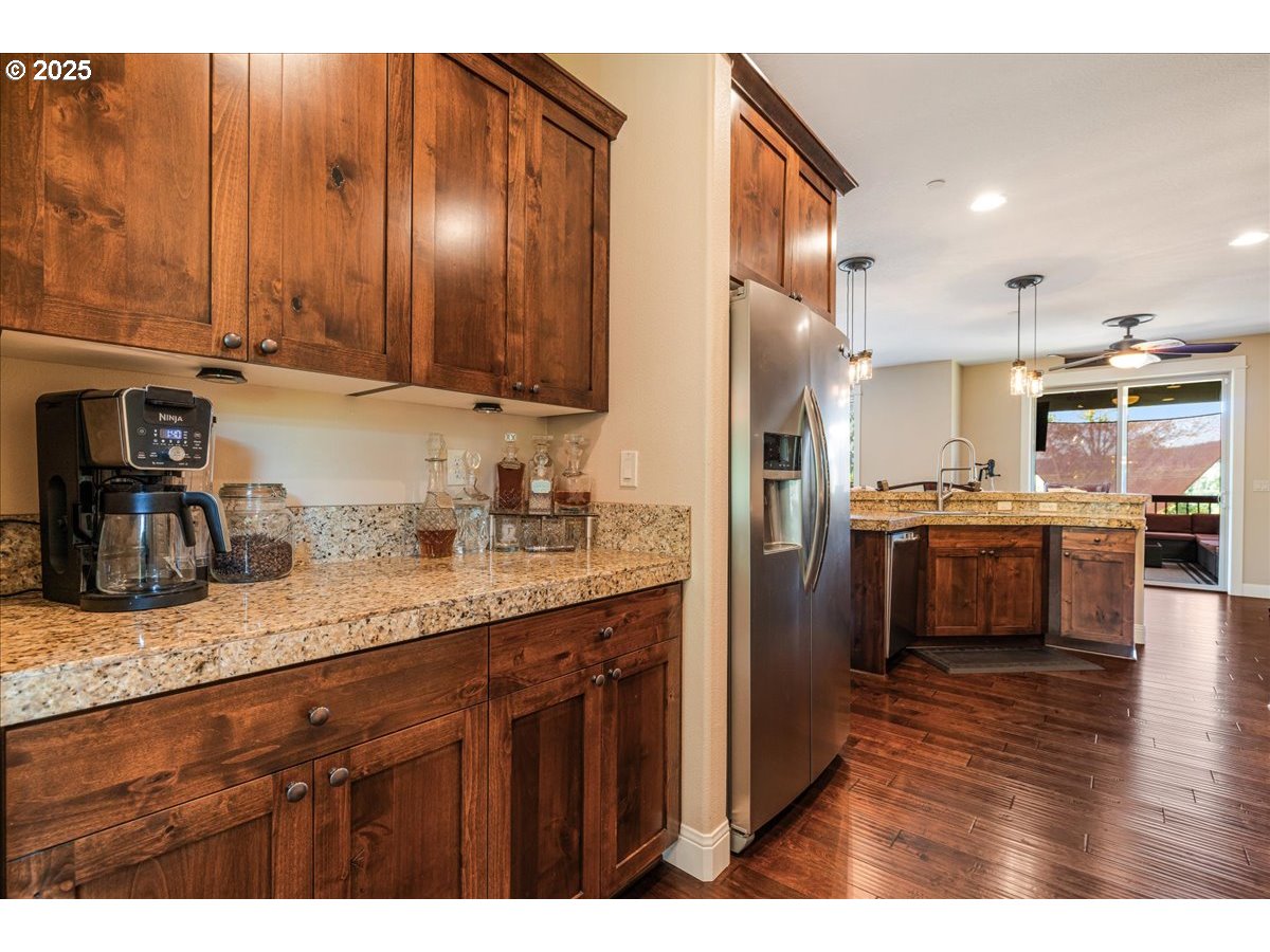 45632 Northwest Mead Way Banks, OR 97106 - Photo 11 of 48 a kitchen with stainless steel appliances granite countertop a sink a stove and a refrigerator