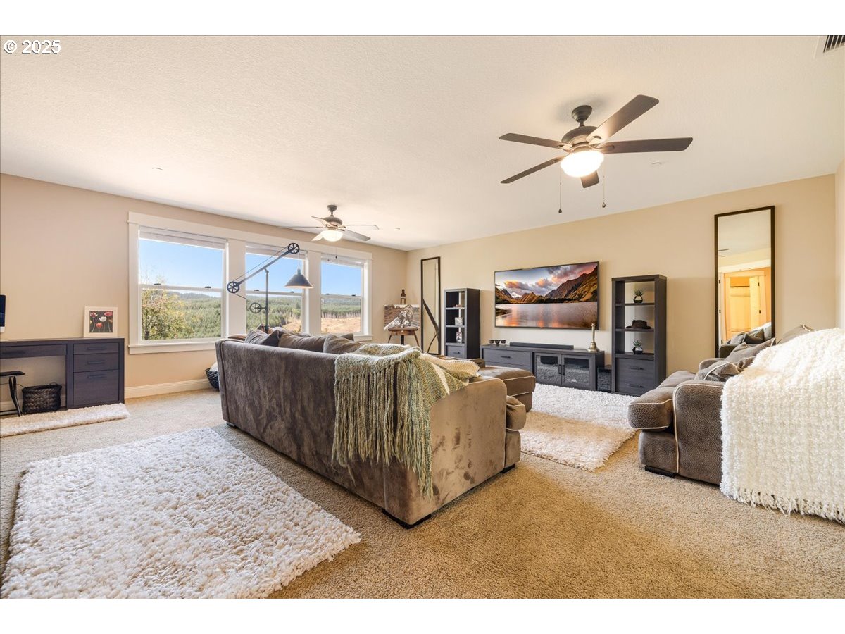 45632 Northwest Mead Way Banks, OR 97106 - Photo 17 of 48 a living room with furniture and a kitchen view