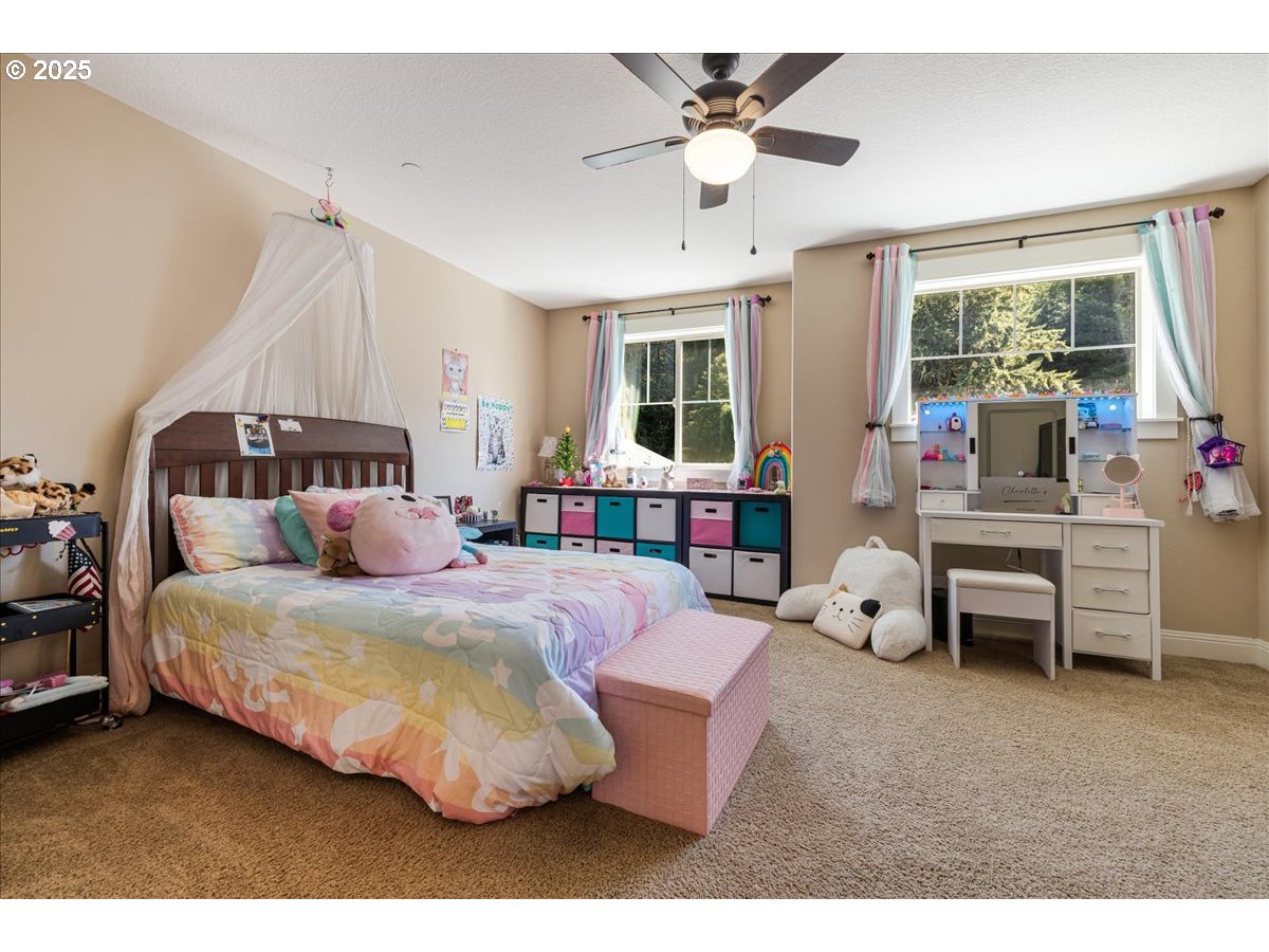 45632 Northwest Mead Way Banks, OR 97106 - Photo 19 of 48 a bedroom with a bed couch and window