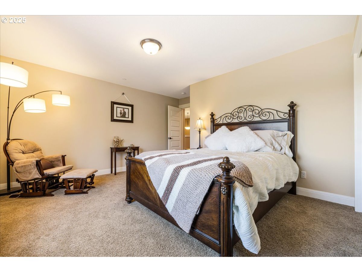45632 Northwest Mead Way Banks, OR 97106 - Photo 21 of 48 a bed room with a bed and a chair