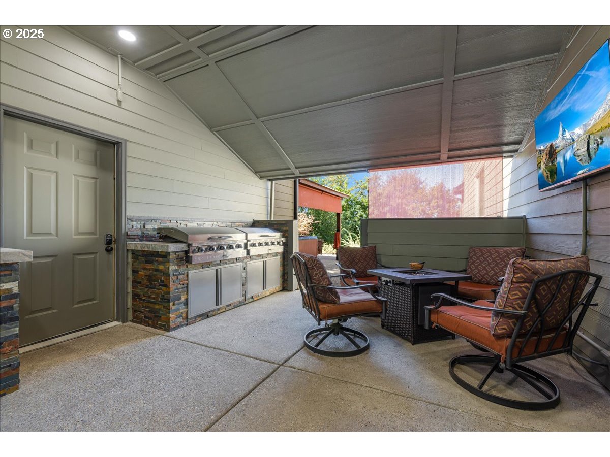 45632 Northwest Mead Way Banks, OR 97106 - Photo 25 of 48 a kitchen with a stove a table and chairs in it