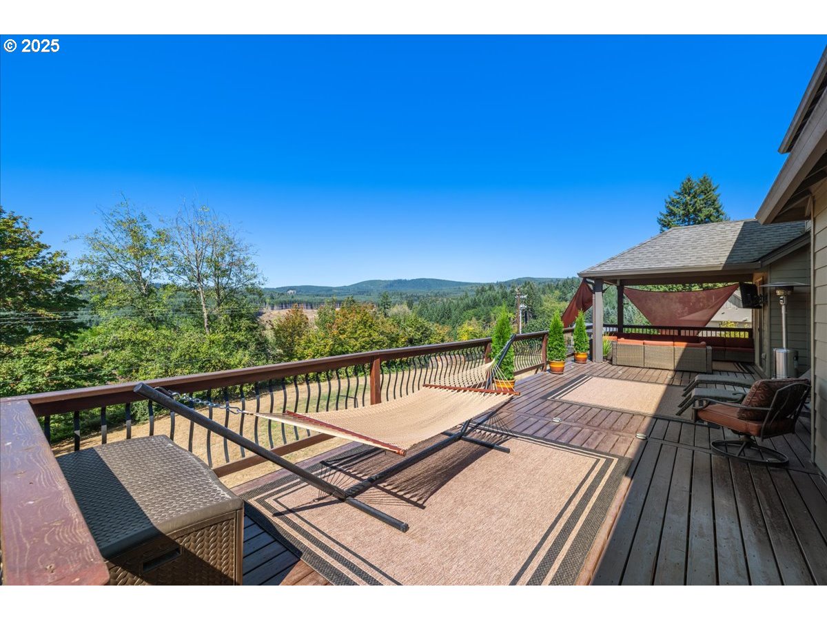 45632 Northwest Mead Way Banks, OR 97106 - Photo 26 of 48 a view of a balcony with wooden floor and outdoor seating