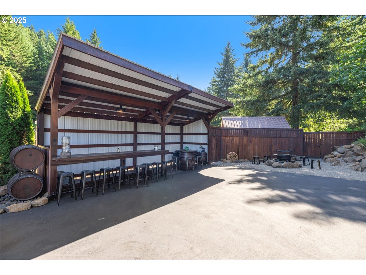 45632 Northwest Mead Way Banks, OR 97106 - Photo 33 of 48 a backyard of a house with table and chairs