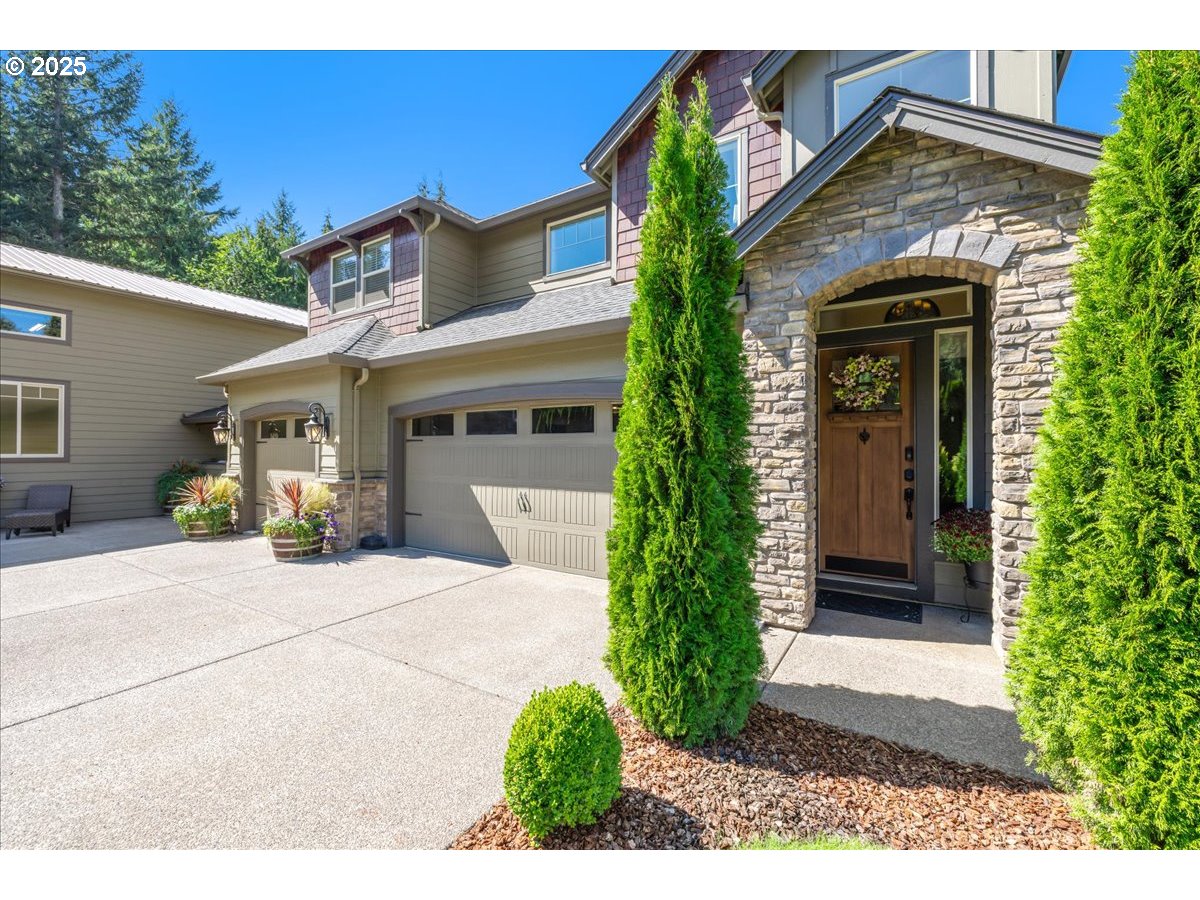 45632 Northwest Mead Way Banks, OR 97106 - Photo 46 of 48 a view of a house with potted plants and a garage