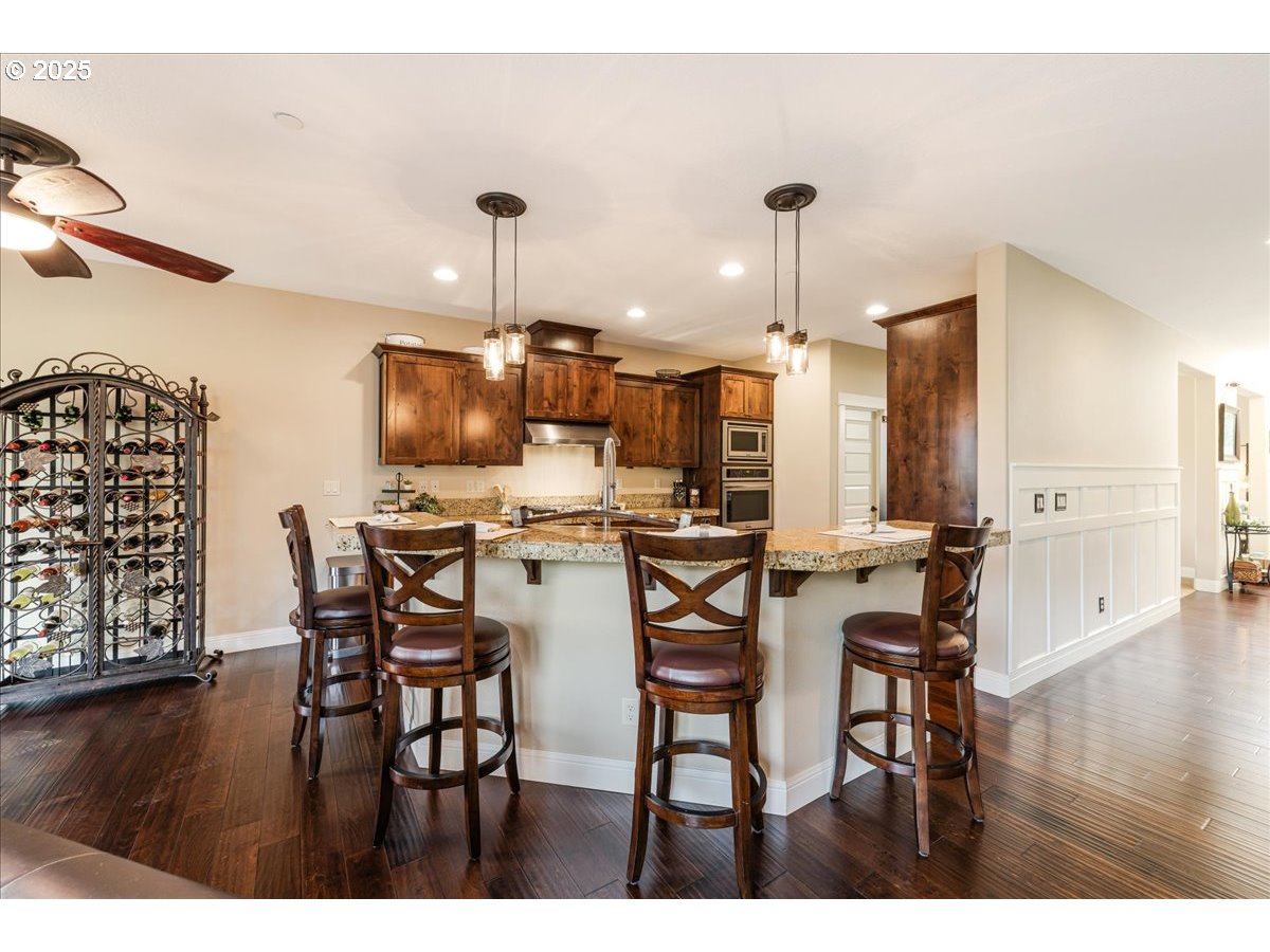 45632 Northwest Mead Way Banks, OR 97106 - Photo 10 of 48 a view of a dining room with furniture and wooden floor