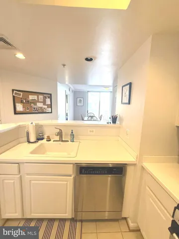 a view of a dining room with furniture and a window