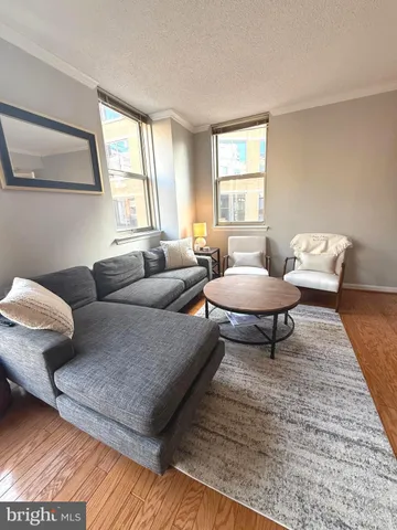 a spacious bedroom with a bed and a large window