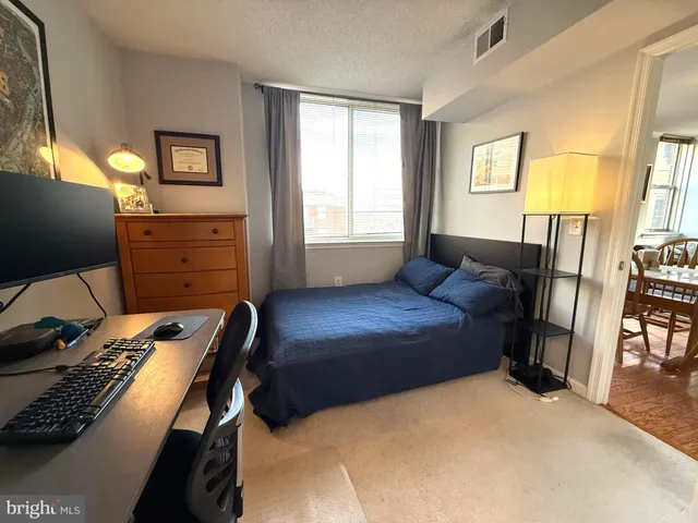 a bathroom with a sink a toilet a mirror and a tub