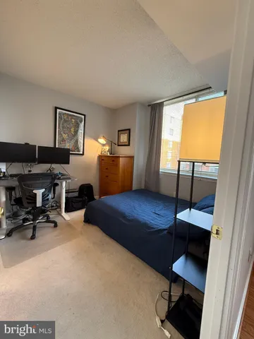 a front view of a building with a yard