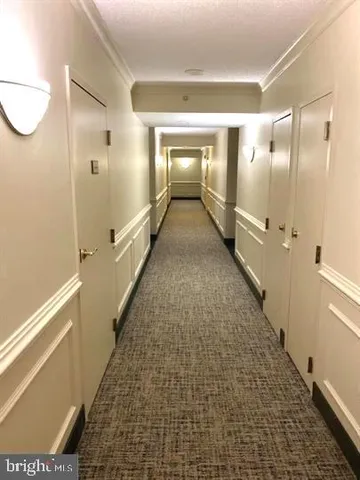 a bathroom with a glass door shower and a sink