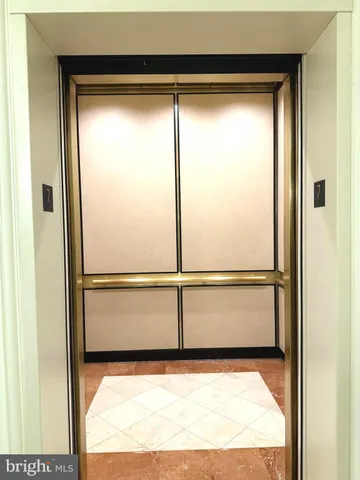 a lobby with furniture and a floor to ceiling window