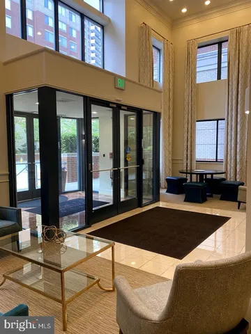 a view of a building with a tree in front