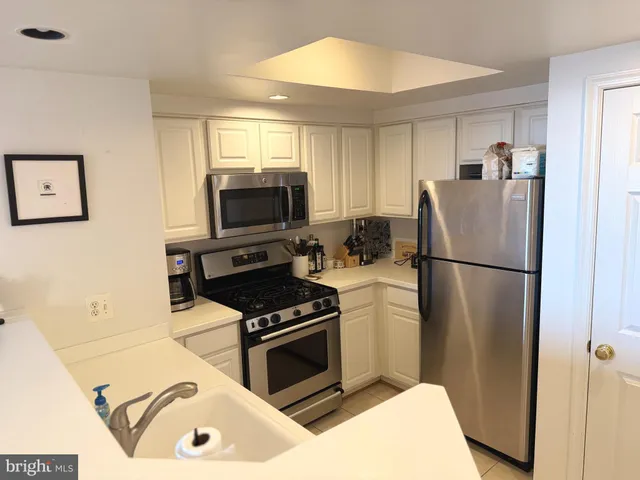 a kitchen with a stove and a microwave