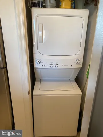 a view of a dining room with furniture a fireplace and wooden floor
