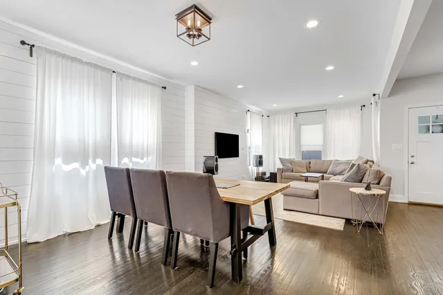 a view of a dining room with furniture window and wooden floor
