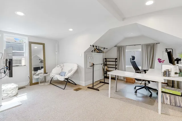 a view of a workspace with furniture