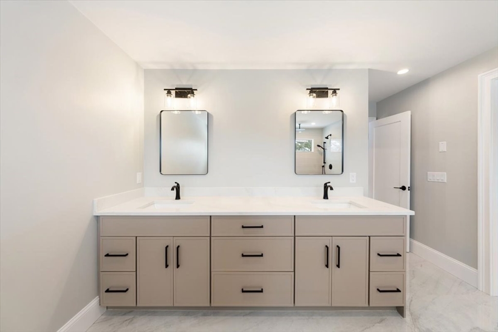 37 Longfellow Road Natick, MA 01760 - Photo 17 of 25 a bathroom with a double vanity sink and mirror