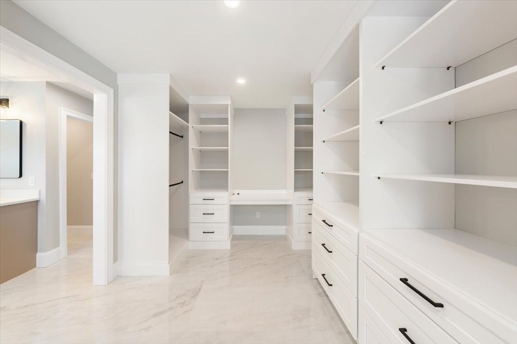 37 Longfellow Road Natick, MA 01760 - Photo 21 of 25 a view of walk in closet and empty racks